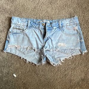 Light wash distressed jean shorts.